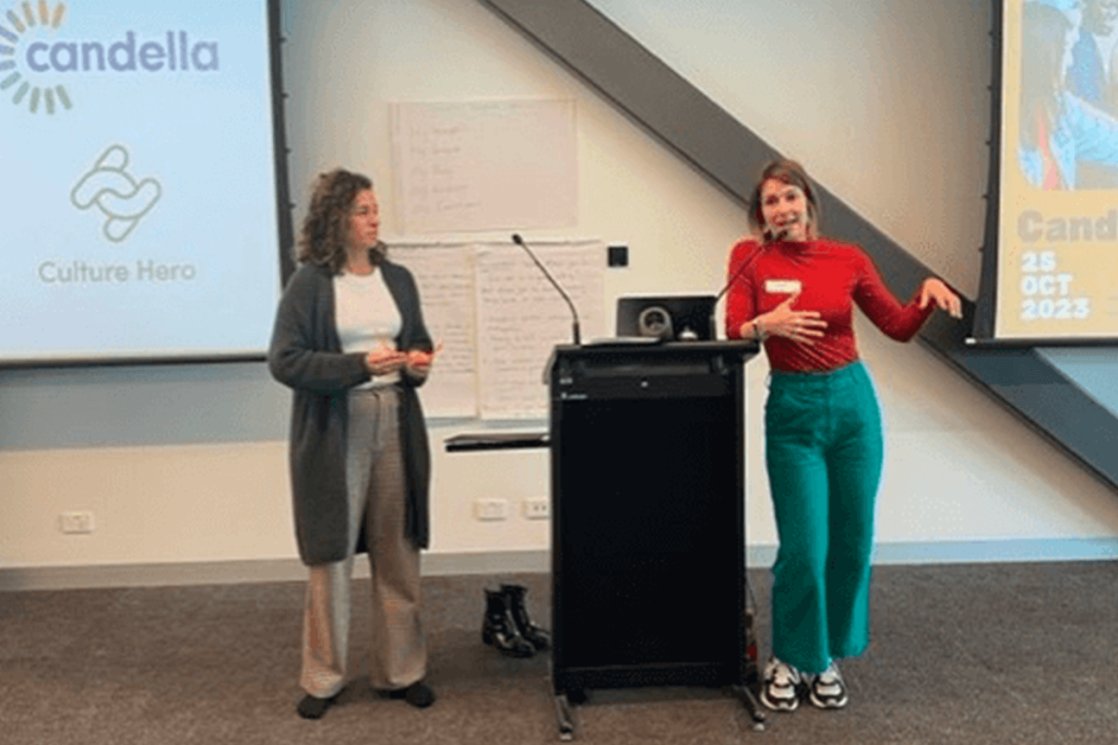 Two women speaking at a podium for Candella Day 2023